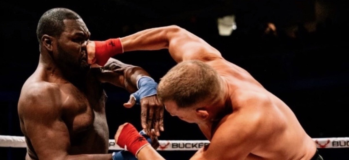 Anthony Garrett throwing a heavy hook at his opponent