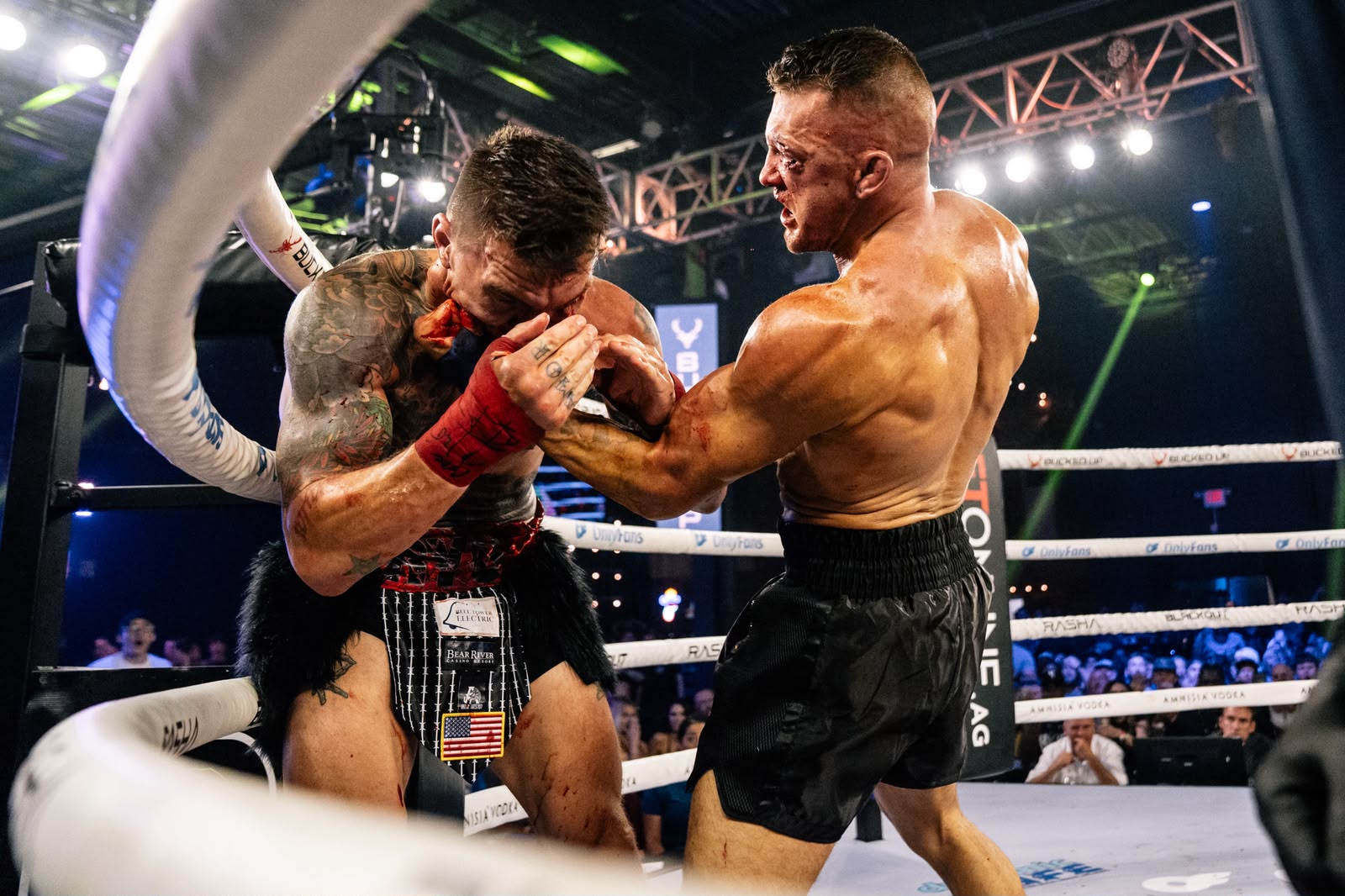 Dustin Pague landing a punch against the ropes