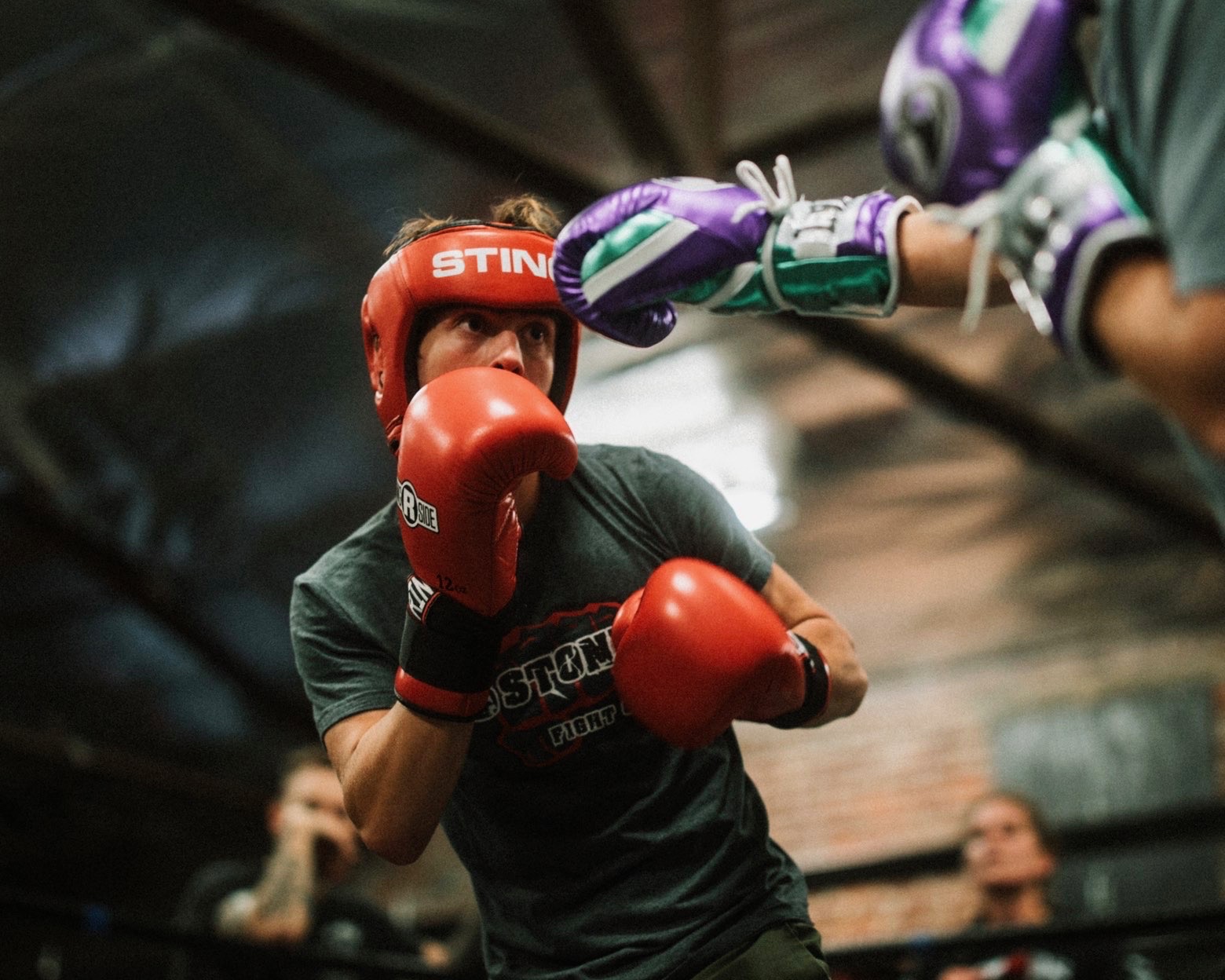 Andrew Waybright sparring in red headgear and gloves