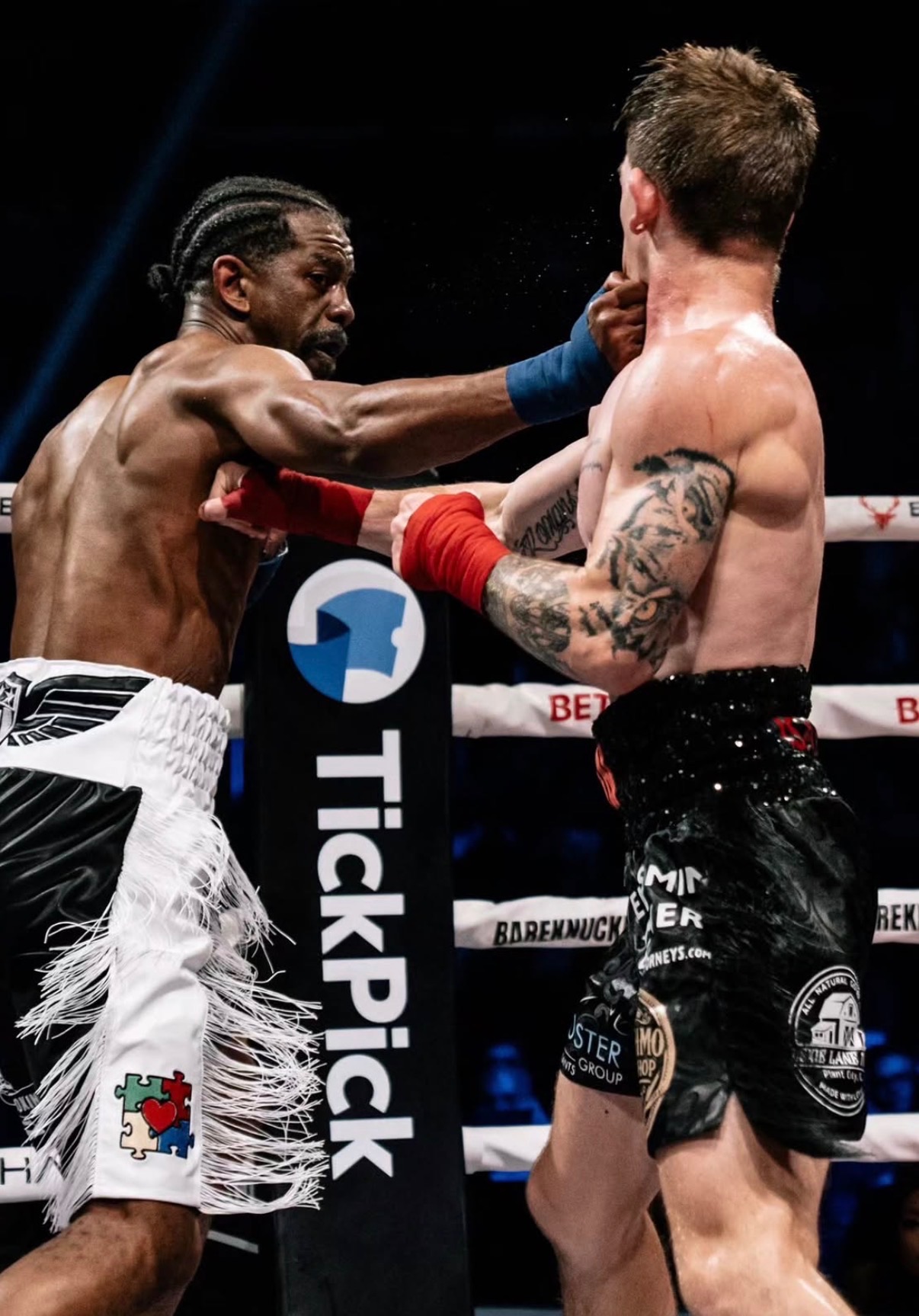 Jamel Herring pressuring his opponent against the ropes