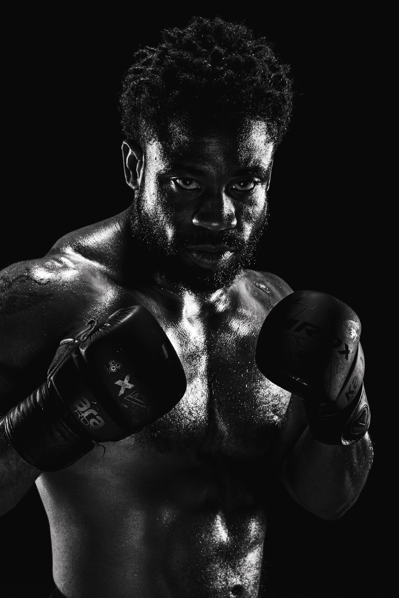 Devin Thomas in a boxing stance black and white portrait