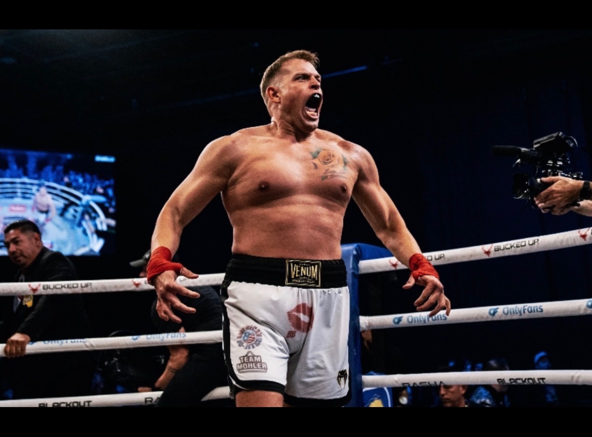 Anthony Garrett roaring in celebration inside the BKFC ring
