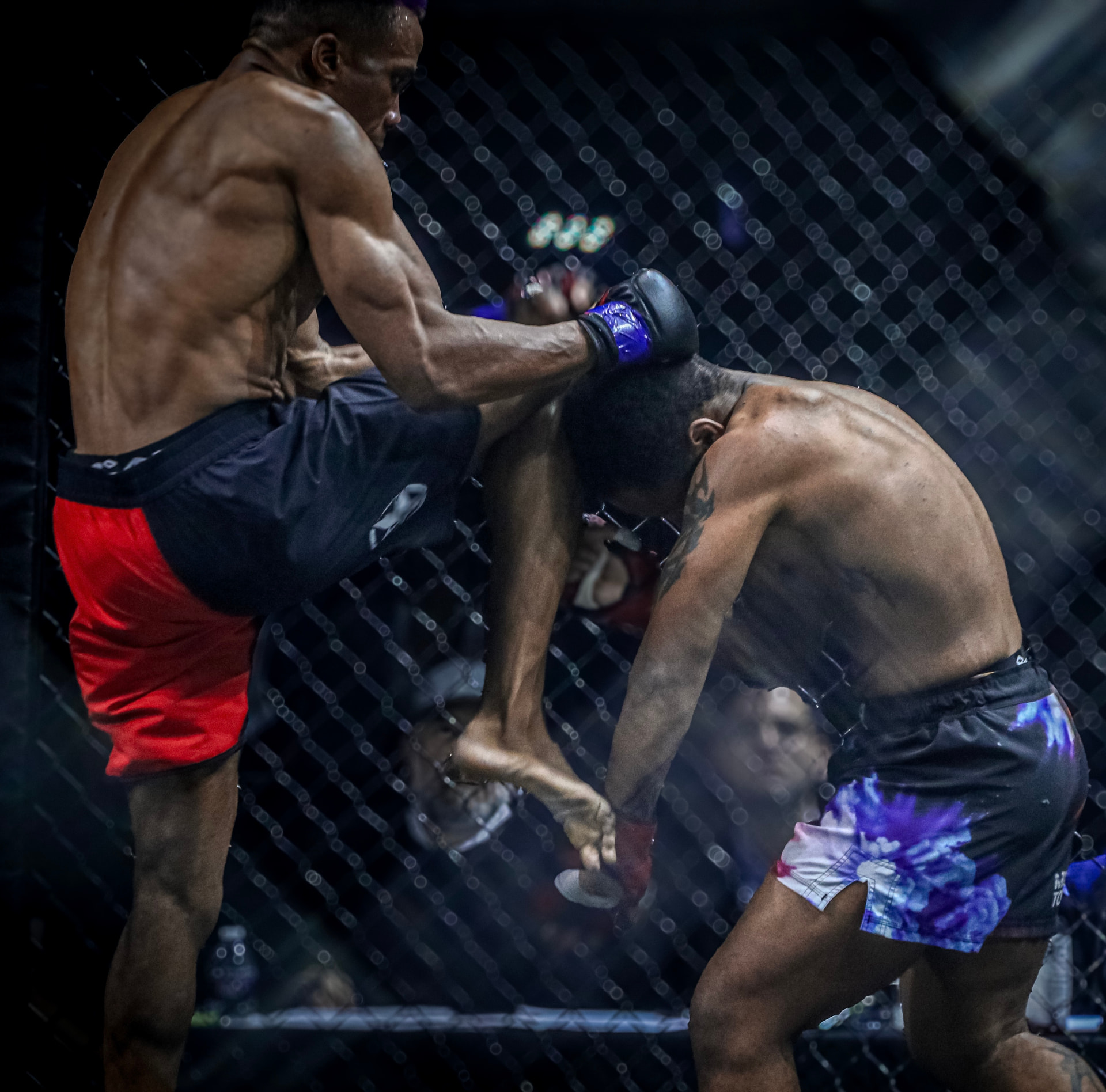 George Watkins landing a knee strike in the clinch