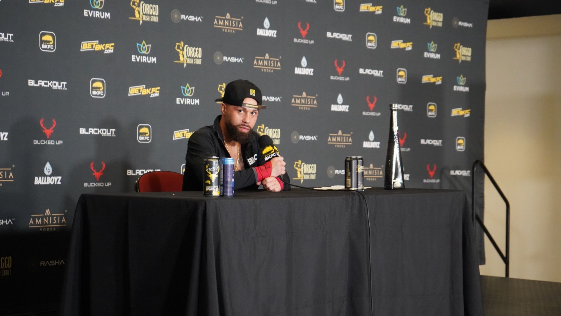 Quentin "QG" Gaskins at the BKFC post-fight press conference table