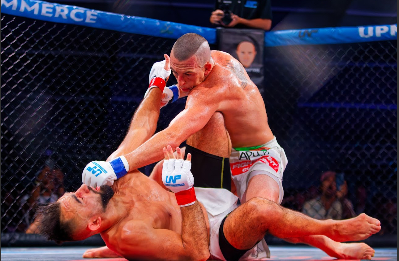 Tommy Aaron landing ground strikes on his opponent