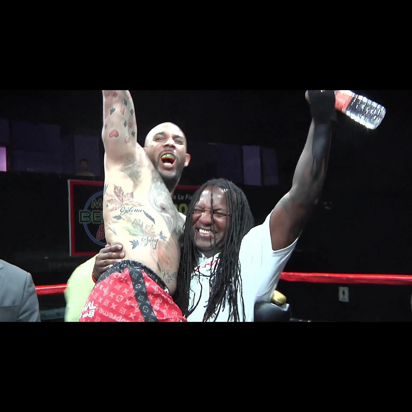 Terryl Johnson celebrating a victory with his corner